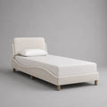 Letto singolo imbottito 90 x 200 cm con testiera rivestita in poliestere, bianco crema e legno naturale, 105 x 215 x 105 cm
